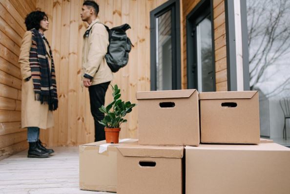 a couple moving into a new home
