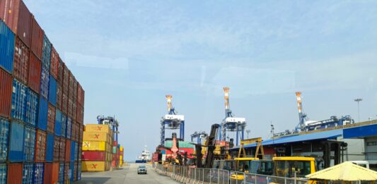 terminal with containers trucks and cranes