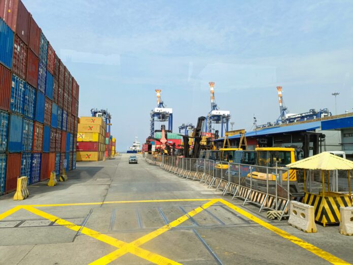 terminal with containers trucks and cranes