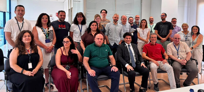 Amar More, Co-Founder and Chief Executive Officer, Kalé Logistics Solutions (front row, centre), with the Portel Logistics Technologies team in their Spanish office.