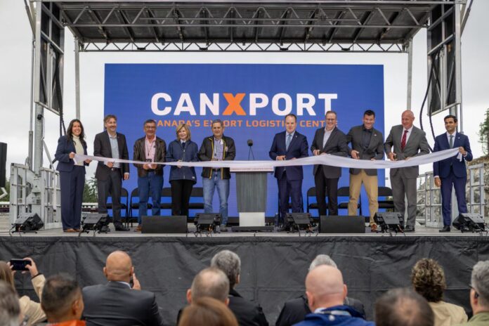 5b003429-0328-90ce-01b3-ee356f3b68bd Officials and project partners cut the ribbon at the opening ceremony of the CANXPORT logistics hub at the Port of Prince Rupert.