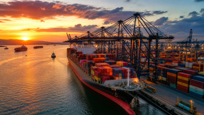 Container ship at a busy container terminal as carriers adjust capacity ahead of China’s Golden Week.