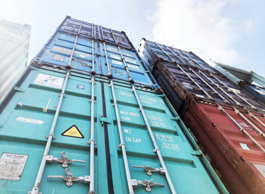blue steel door under white clouds during daytime
