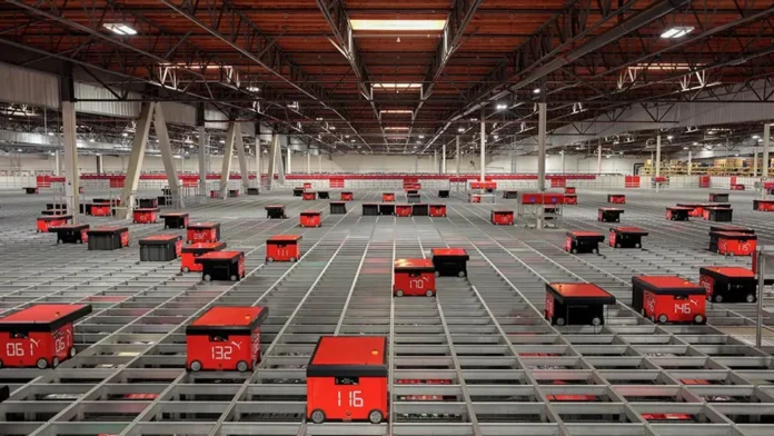 AutoStore robots operating across the automated storage grid at PUMA’s distribution facility in Torrance, California.