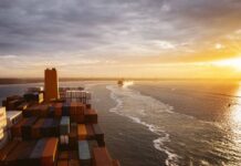 Hapag-Lloyd announces Genoa and Livorno omissions Hapag Lloyd vessel in the sunset